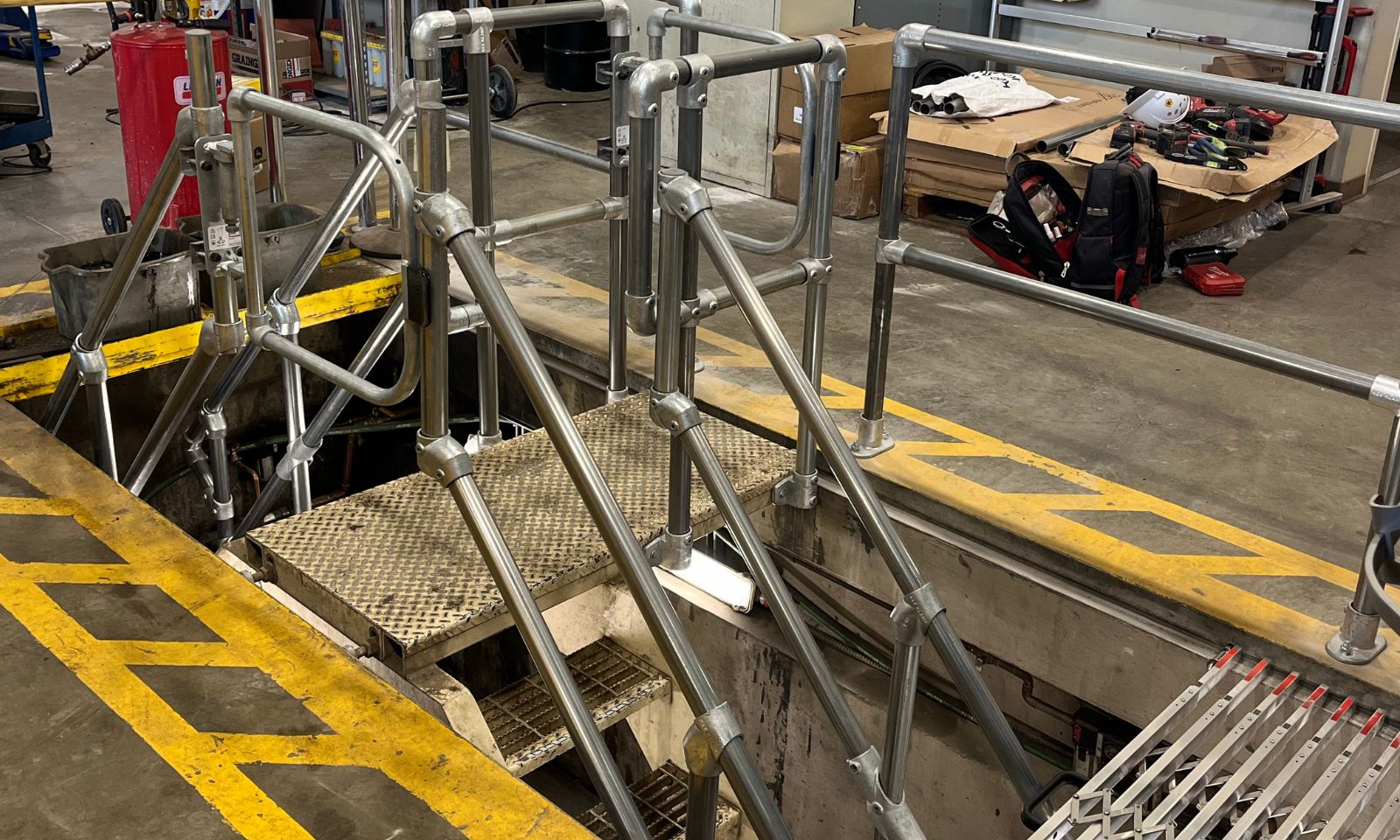 Maintenance pit guard system improving workplace safety