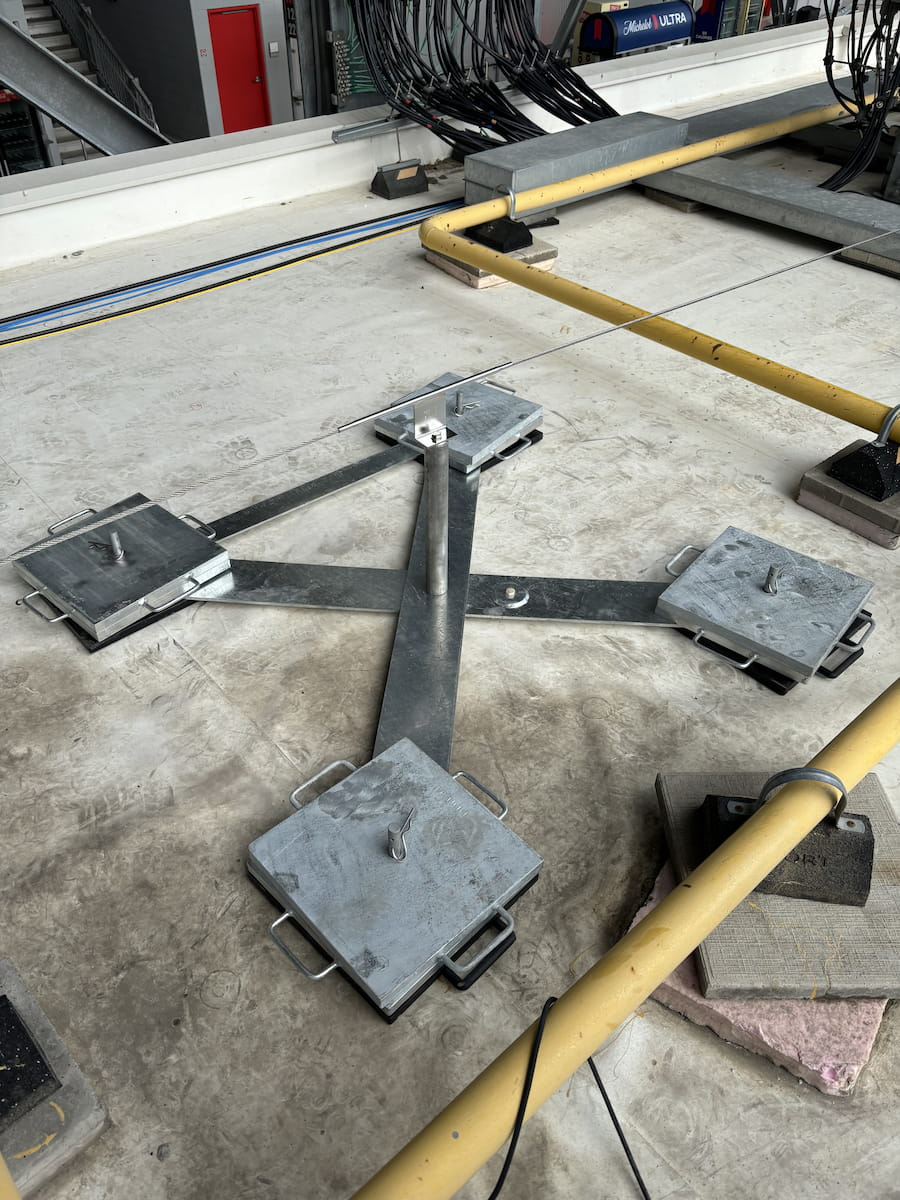 Portable deadweight anchor supporting a horizontal lifeline on the BMO Field roof, providing compliant fall protection for FIFA World Cup 2026 construction activities.