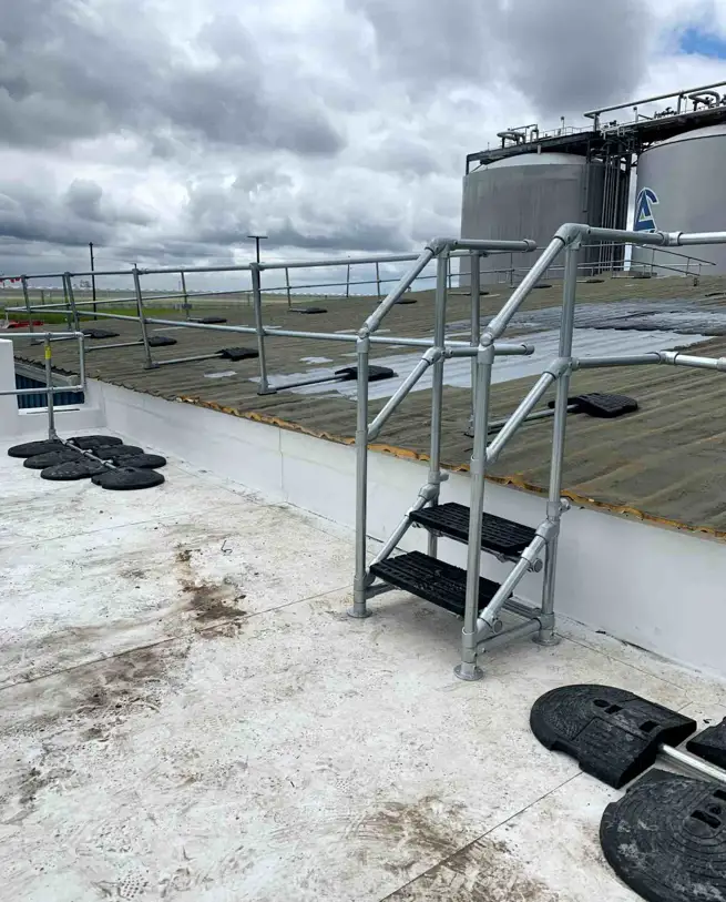 Unprotected Rooftop Edge Kee Guard and Kee Step installed for HVAC Maintenance on the roof - Kee ...