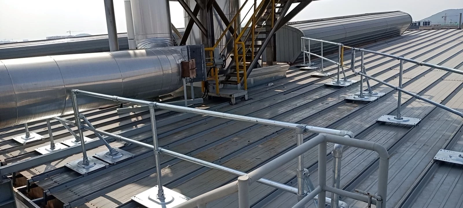 Kee Guard railing installed on an industrial metal roof