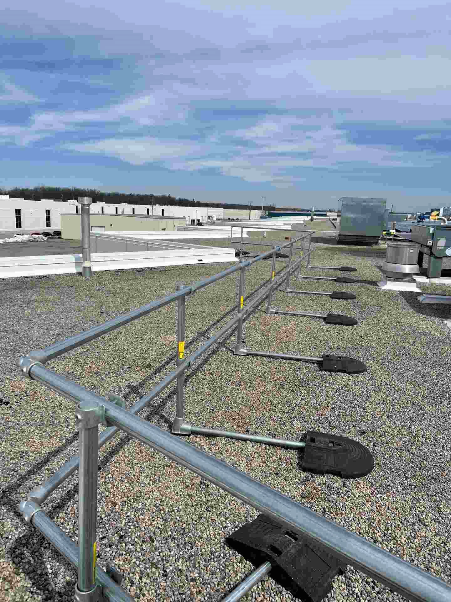 Kee Guard OH&S compliant rooftop guardrail system for Canadian safety standards