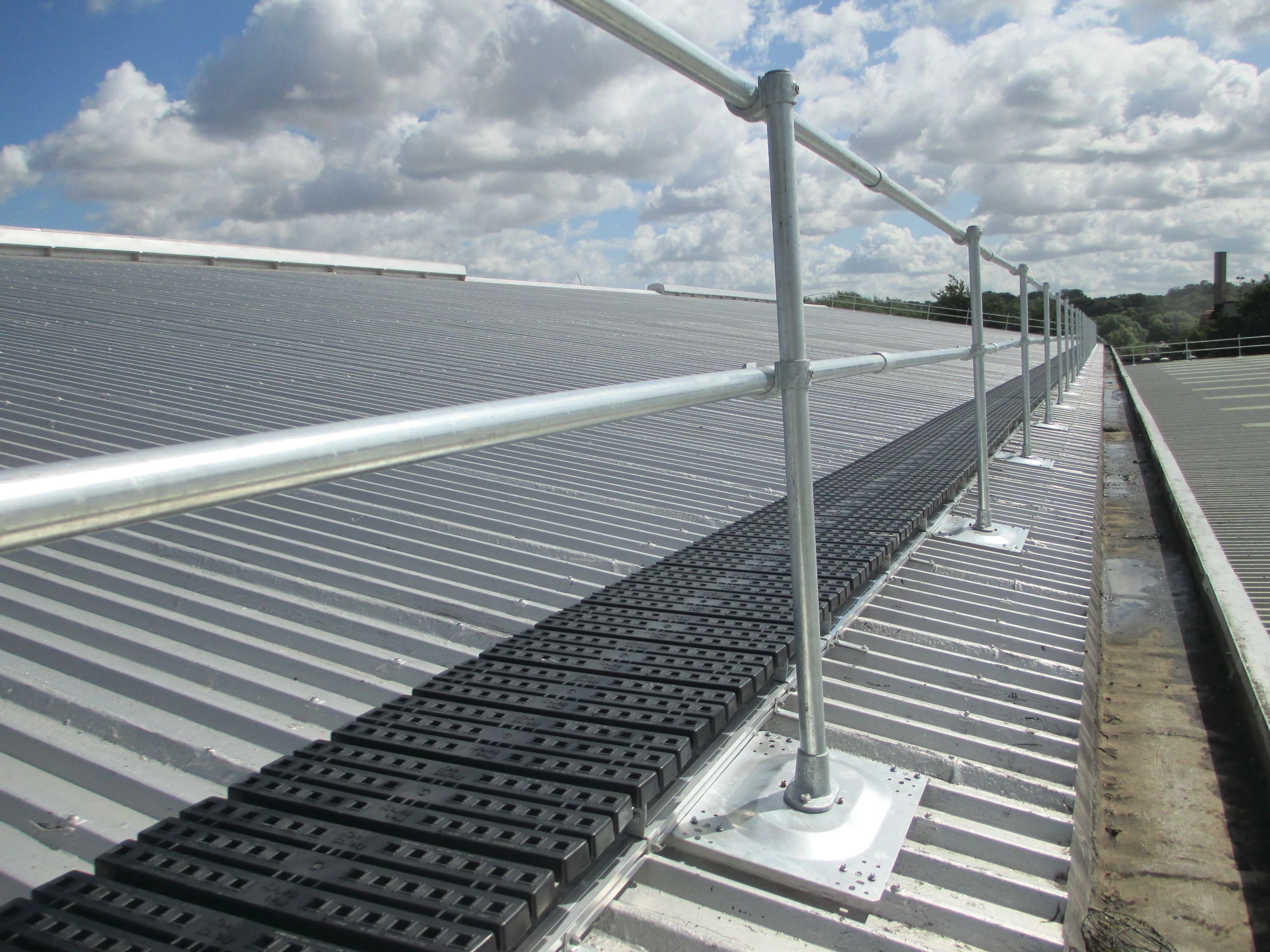 Kee Guard railing with Walkway installed on an industrial metal roof
