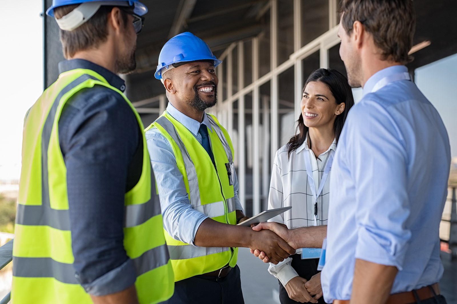 Bigstock Smiling Engineer Shaking Hands 353866670