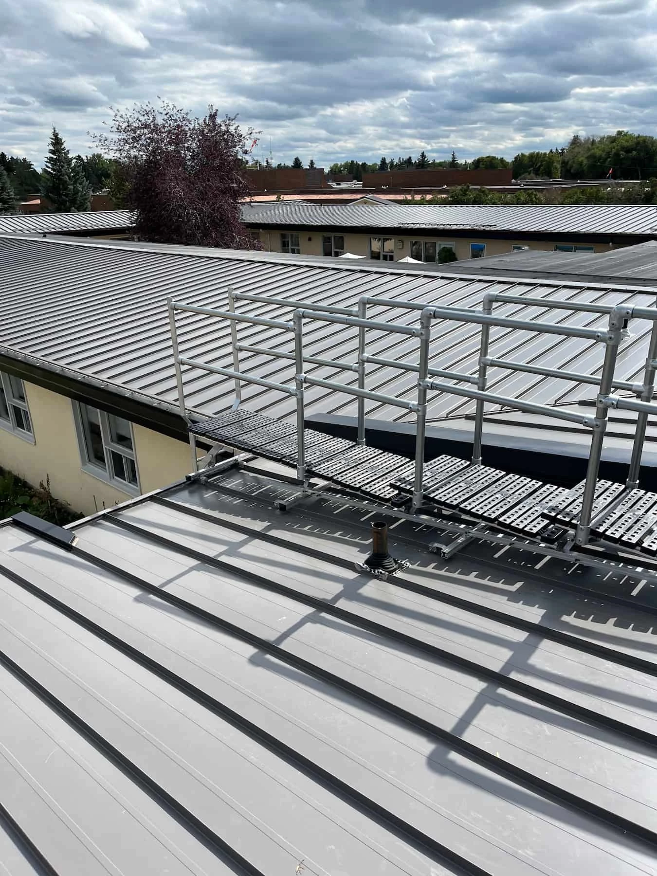 Safe rooftop access system with guardrails in Alberta facility